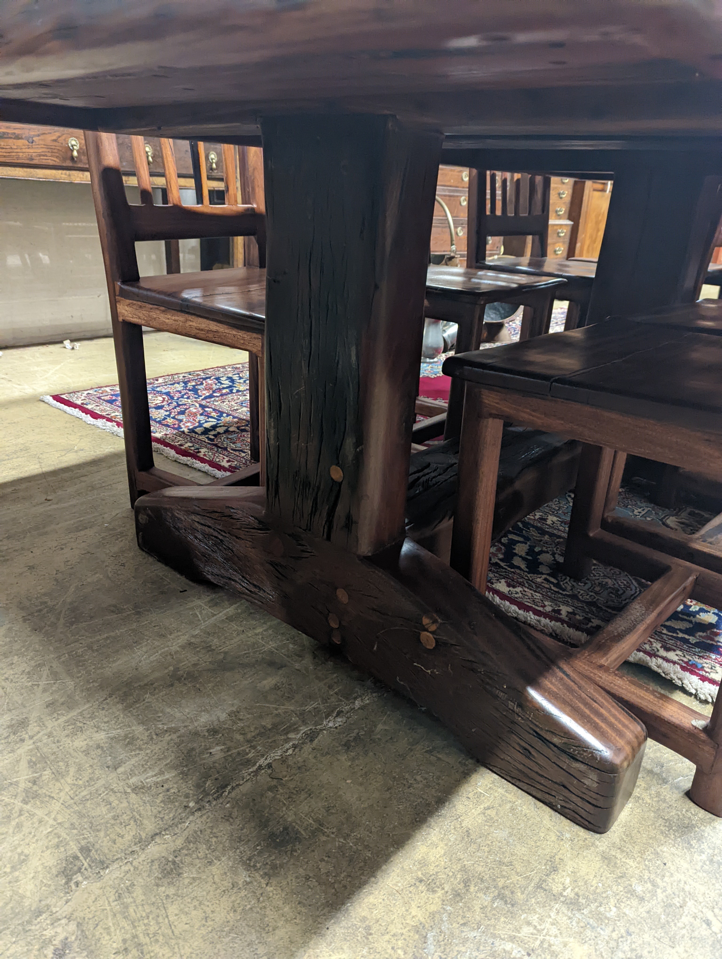 A South African distressed hardwood rectangular refectory dining table, length 200cm, depth 100cm, height 75cm and eight hardwood high back wood seat dining chairs